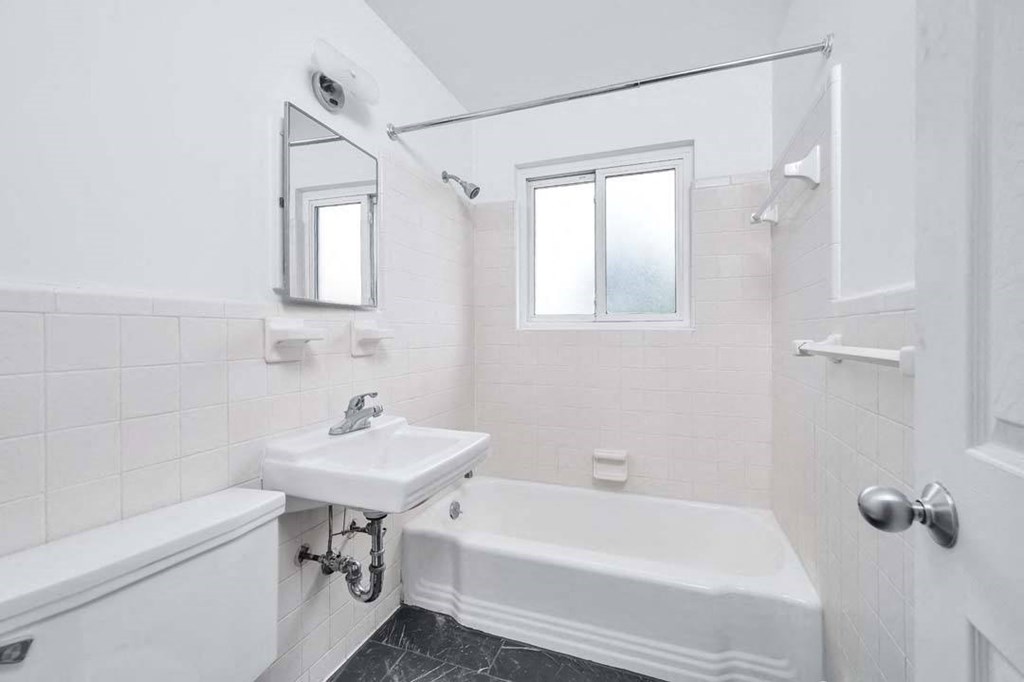a bathroom with a sink and a bathtub
