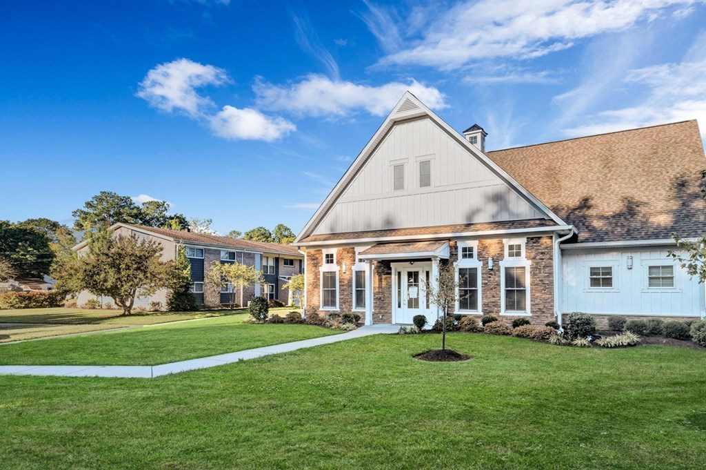 a house with a lawn in front of it