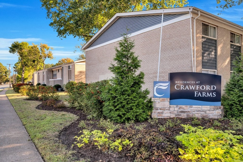 a brick building with a sign that reads crawford farms
