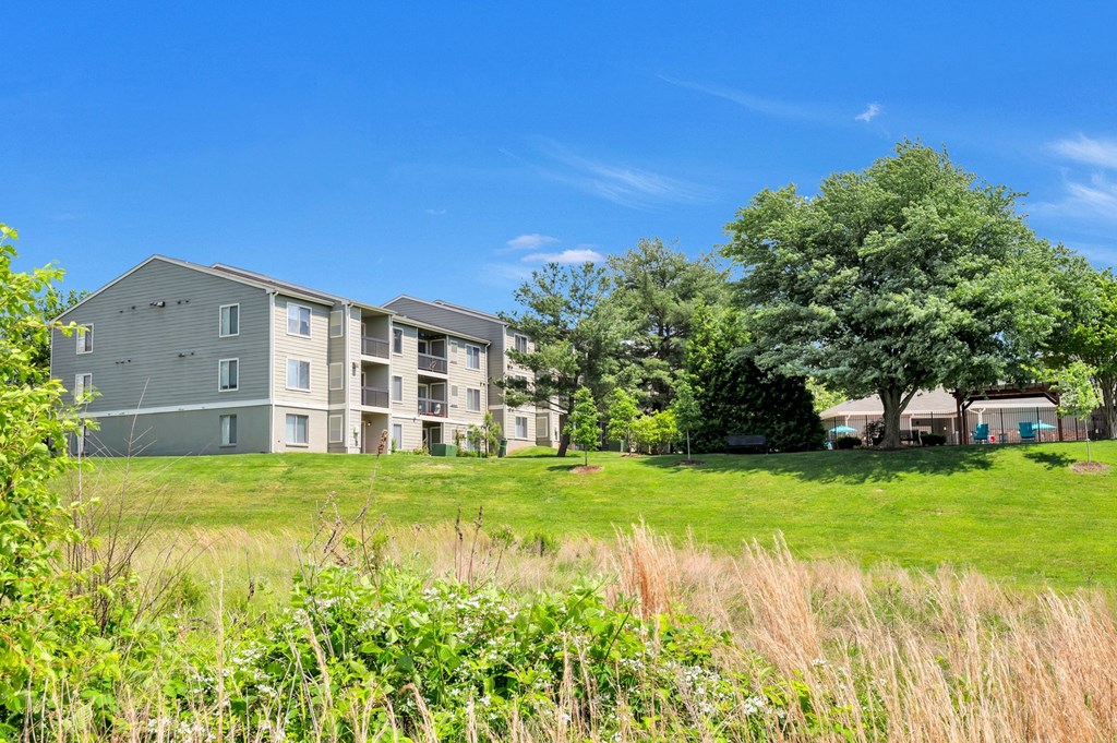 An exterior view from the lake of Waterside at Reston.