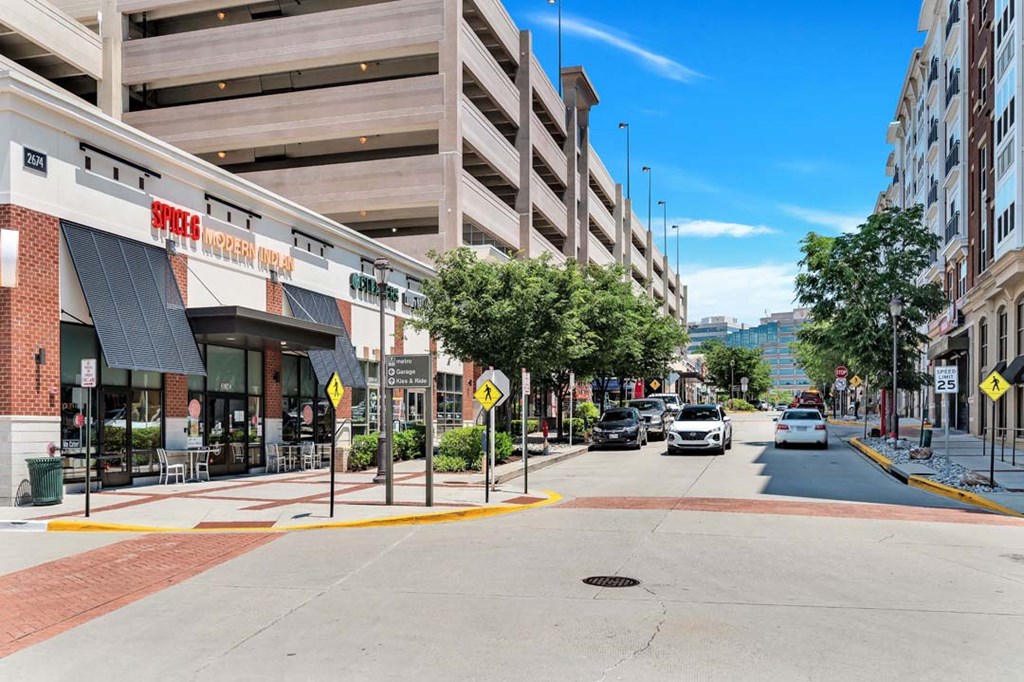 a city street with a building and cars on it