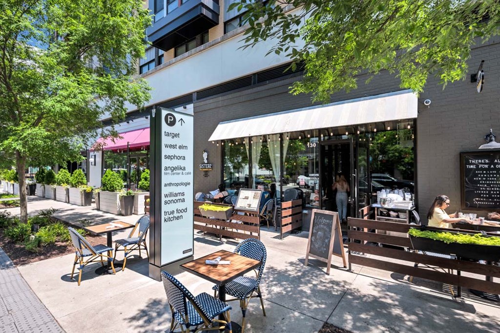 a patio with tables and chairs outside of a restaurant