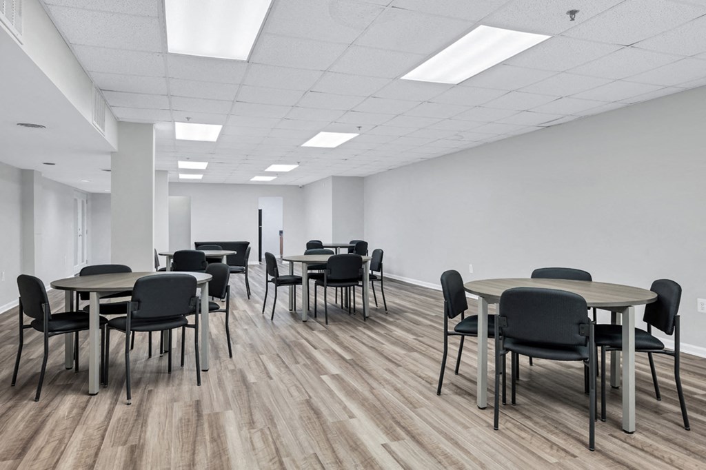 a large room with tables and chairs in it