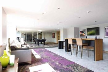 a large living room and dining room with a table and chairs