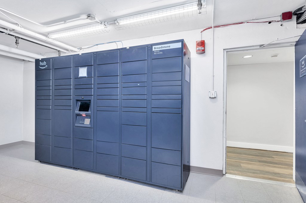 a set of blue lockers in a room with a door
