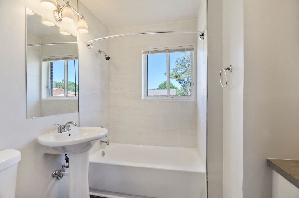 a bathroom with a sink and a bath tub