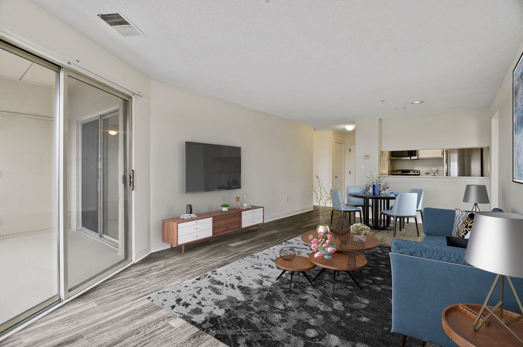 a living room with a couch and a table and a tv
