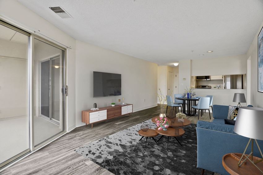 a living room with a couch and a table and a tv