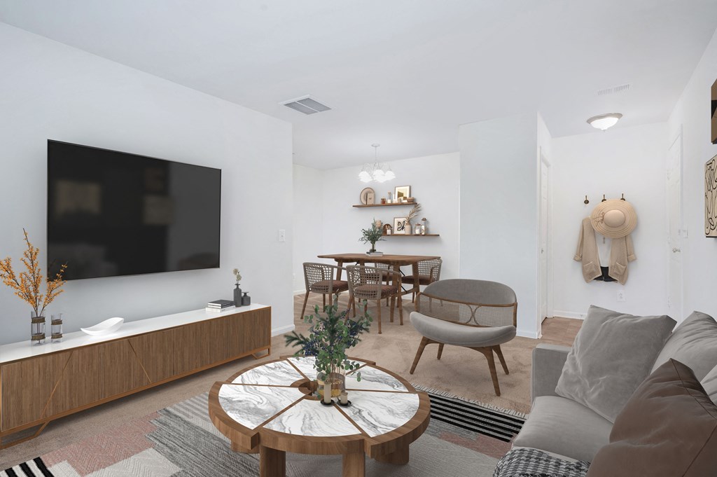 a living room with a couch and a table and a television