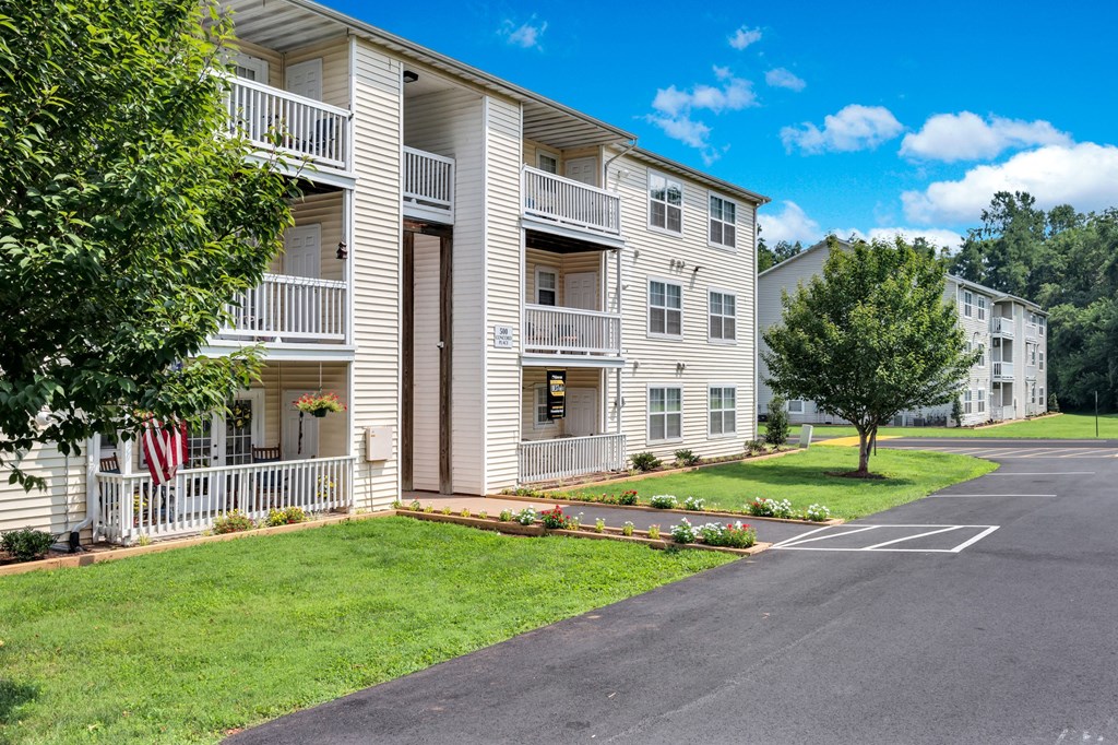 our apartments are located in a quiet area with a tree and grass