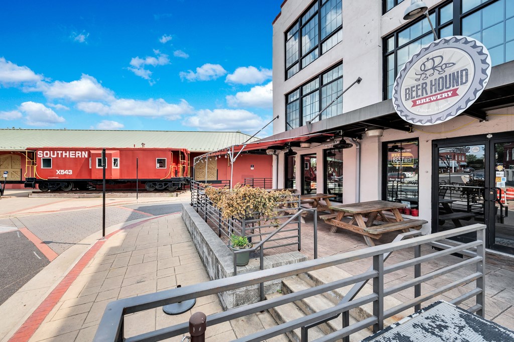a building with a red train parked outside of a restaurant