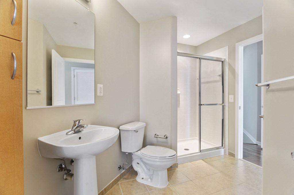 a bathroom with a sink toilet and a shower