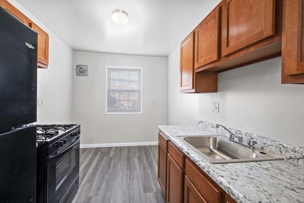 our apartments offer a kitchen with a sink and a stove