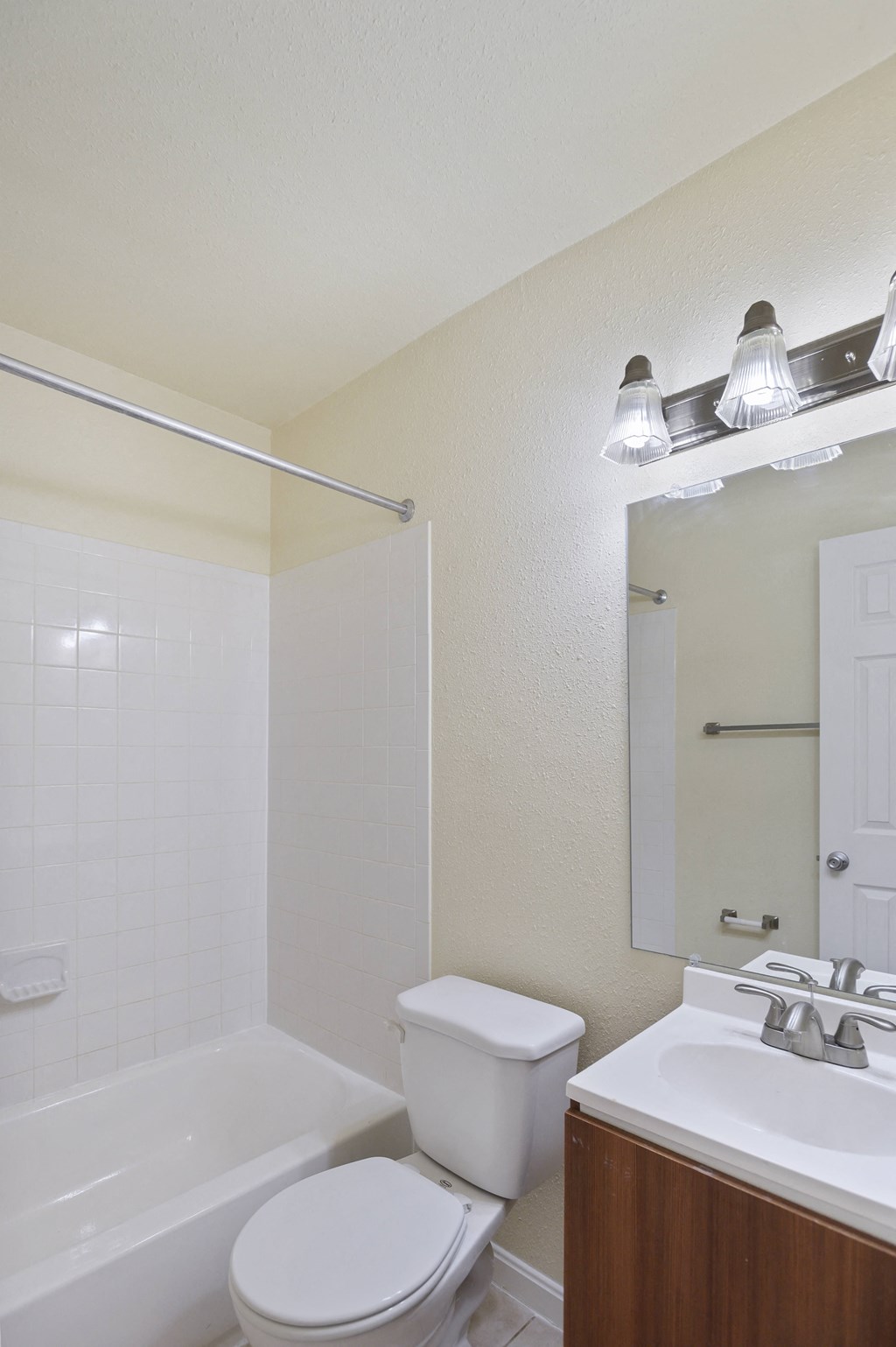 a bathroom with a toilet and a sink and a bath tub