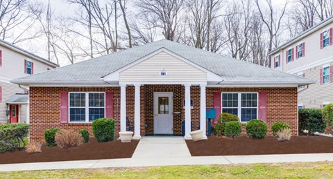 A house with a red door and red window frames.