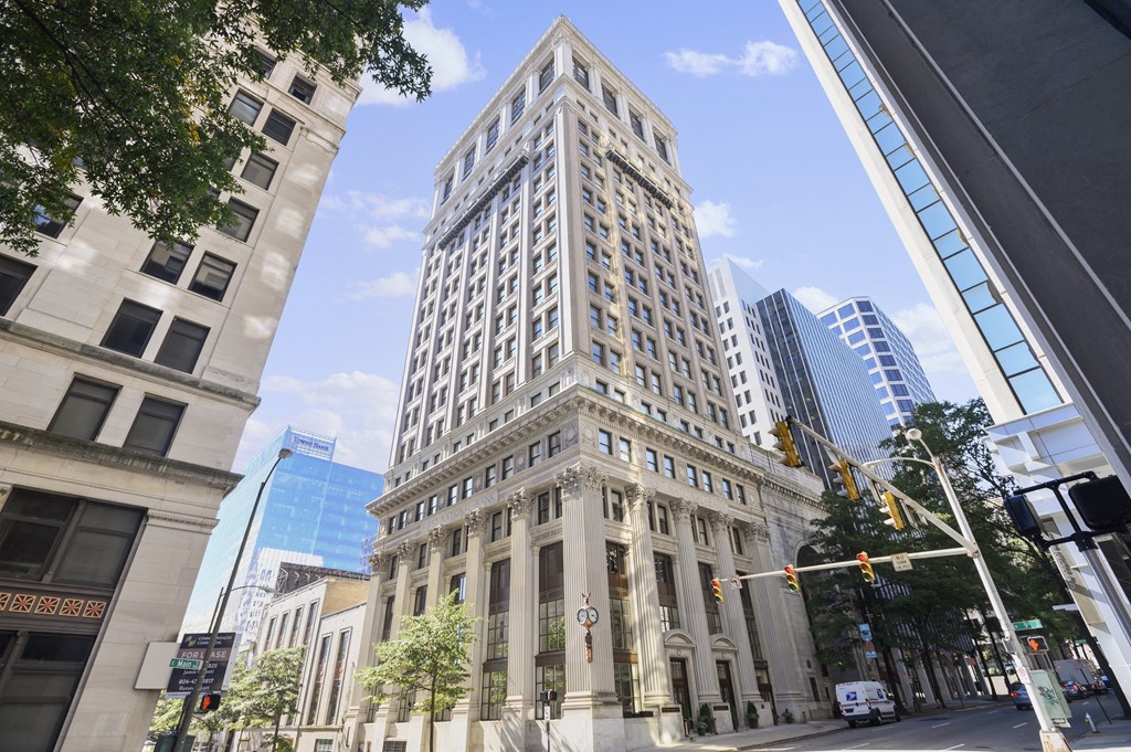 a view of a tall building on a city street