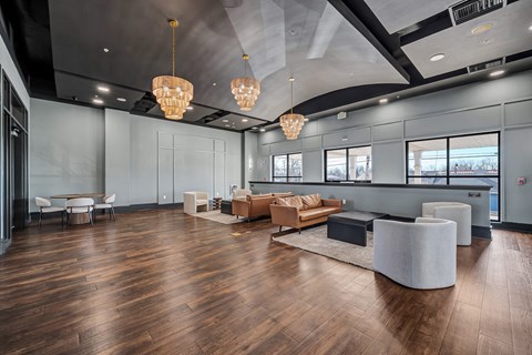 A spacious room with wooden floors and modern furniture.