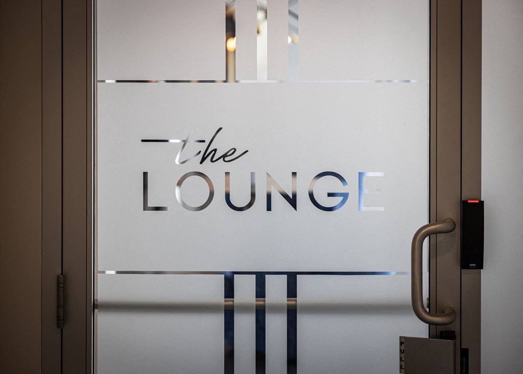 the lobby of the lounge is shown with a sign on the door