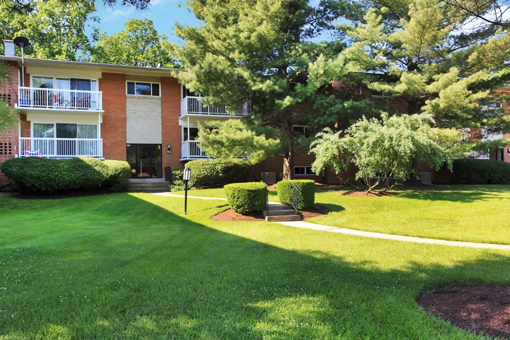 our apartments are located in a quiet neighborhood with a lawn and trees
