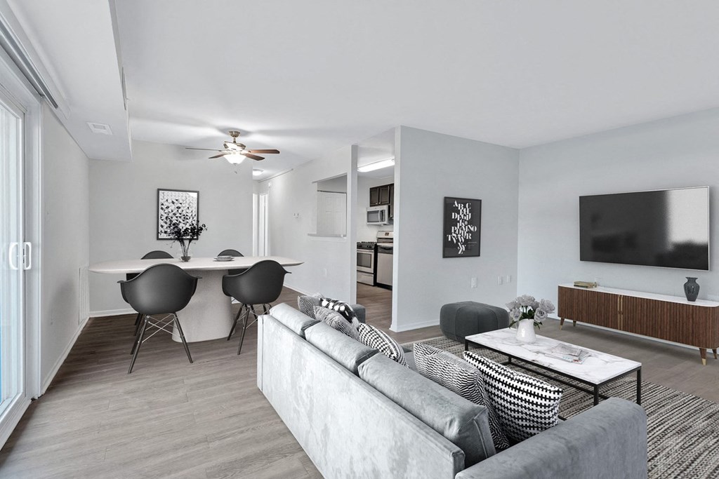 a living room with a couch and a table and a tv