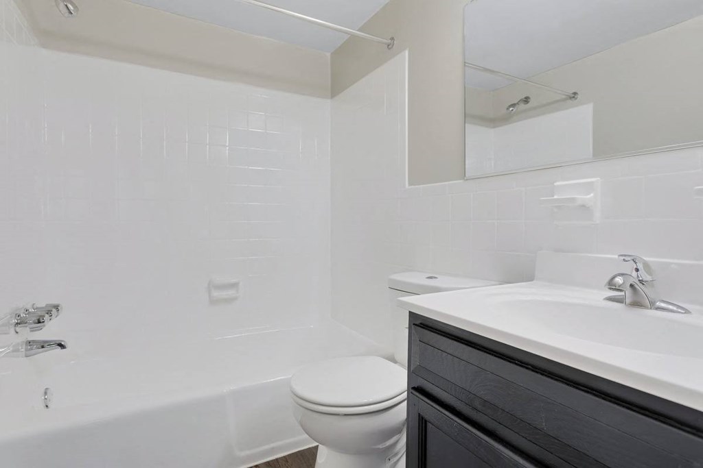 a bathroom with a toilet and a sink