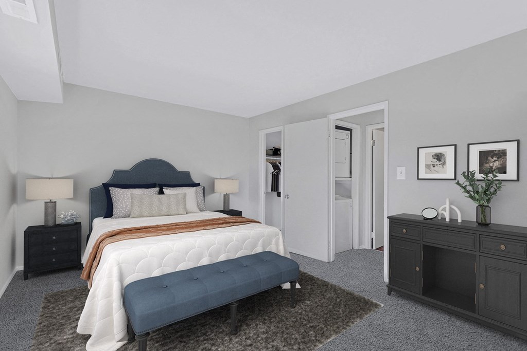 a bedroom with a bed and a dresser