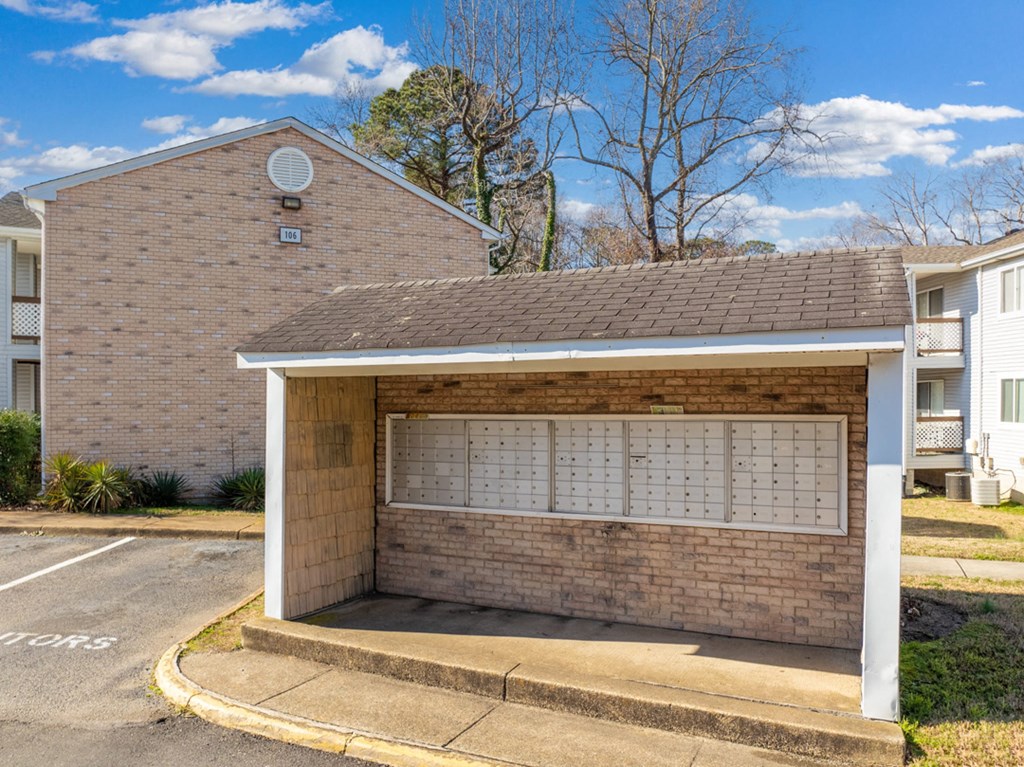 a parking garage in front of a brick building