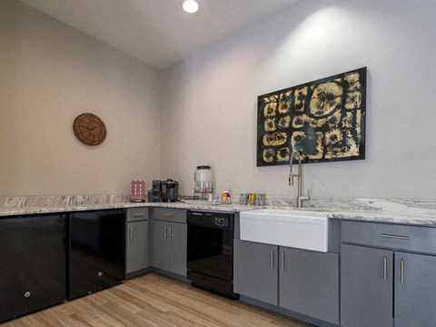 a kitchen with granite counter tops and a sink