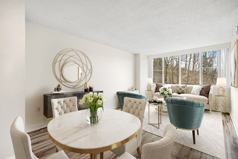 a living room with a table and chairs and a couch