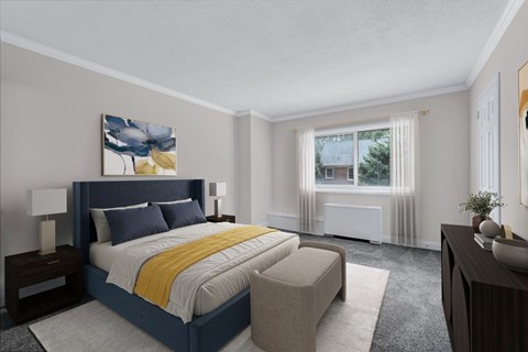 A bedroom with a large bed and a painting on the wall.