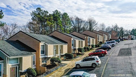 a row of houses on the side of a street