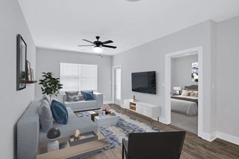 The living room in the Sandstone floor plan at Overlook at Riverside. - Photo Gallery 11