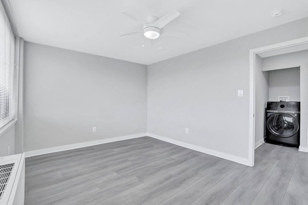 an empty room with a washer and dryer in it