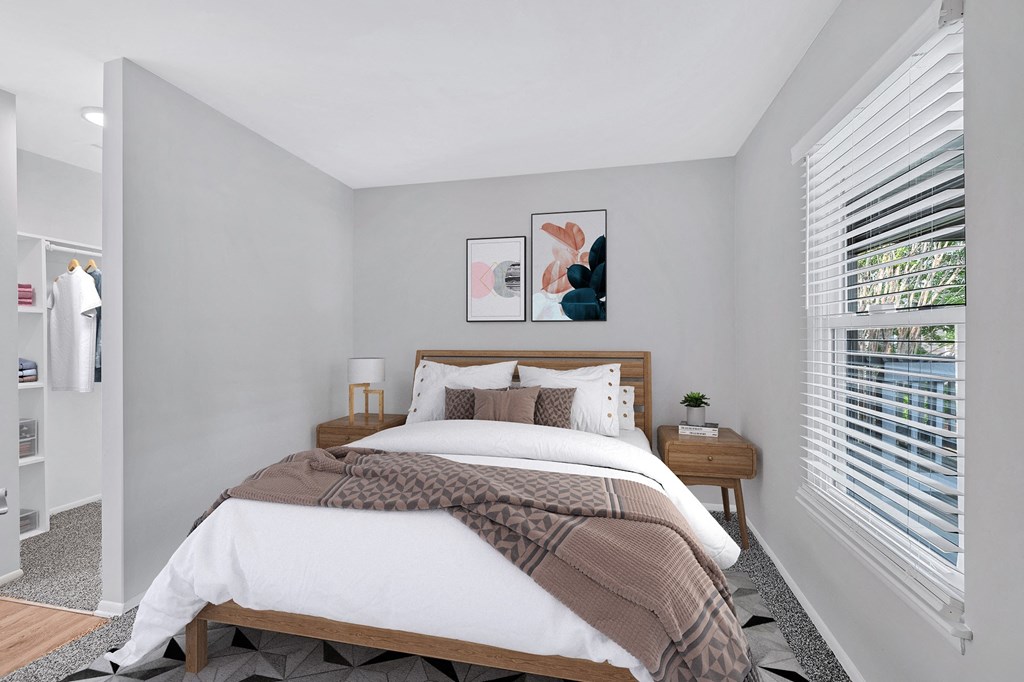 a bedroom with a bed and two night stands