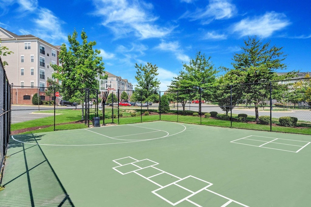 a basketball court at the enclave at city center apartments