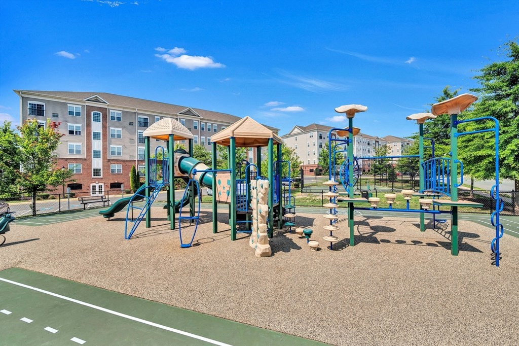 playground with play equipment and buildings
