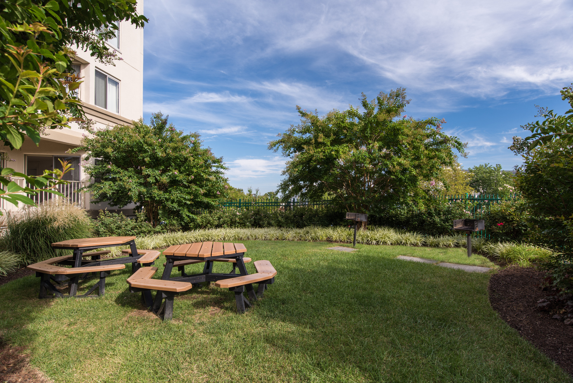 a picnic area in the backyard of a house