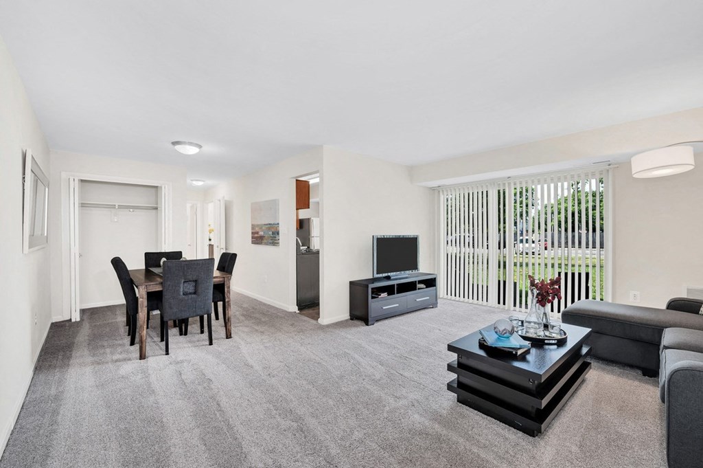a living room with a couch a table and a tv