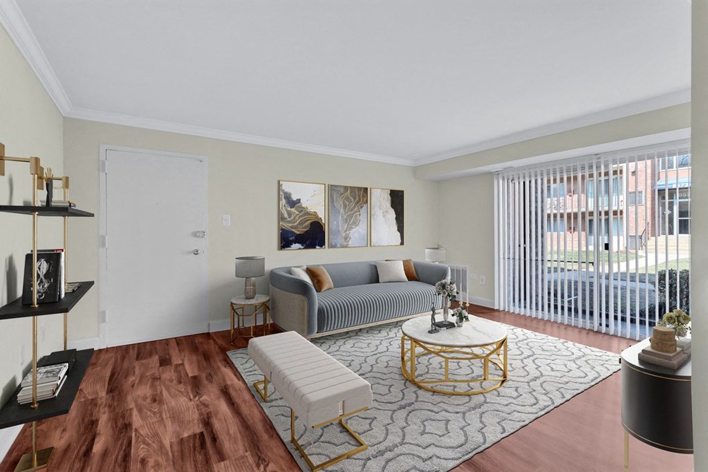 A living room with a grey couch and a coffee table.