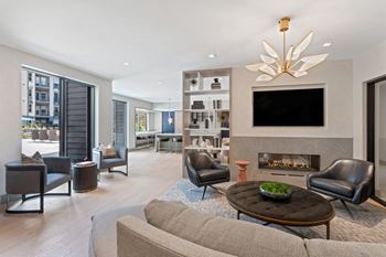 a living room filled with furniture and a fire place