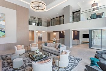a large living room with a large chandelier