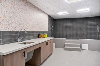 a large bathroom with a shower and sink