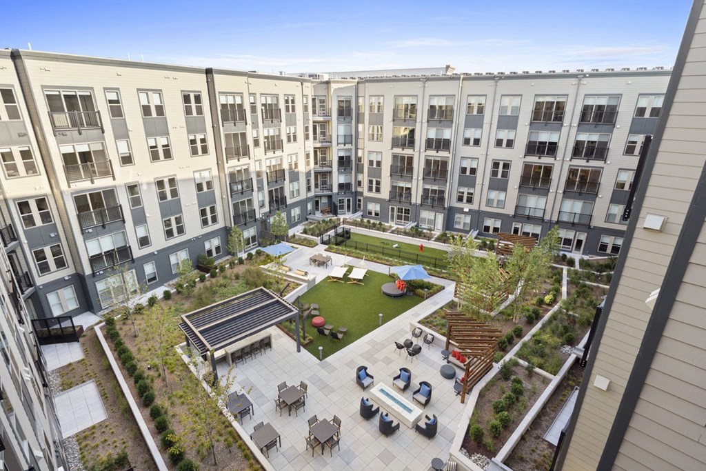 an aerial view of the courtyard of an apartment building