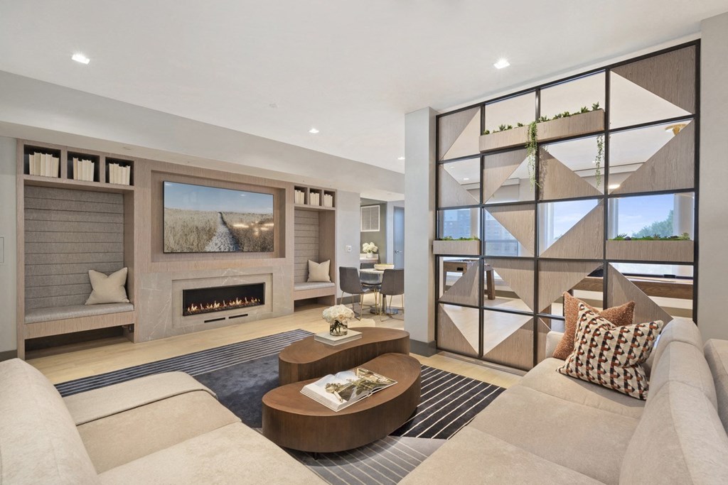 a living room with a couch and a fireplace