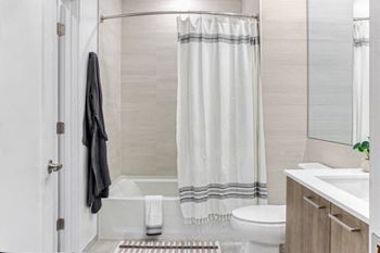 a bathroom with a toilet sink and bathtub