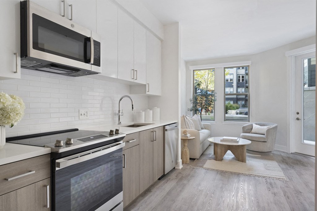 a kitchen with a sink and a microwave