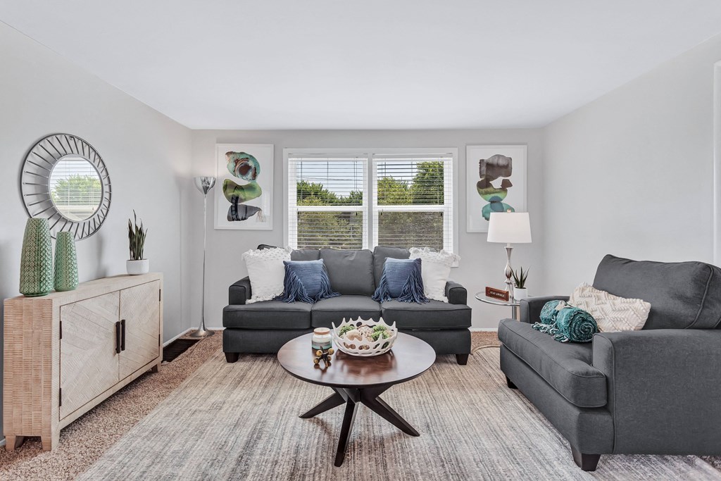 a living room with couches and a coffee table