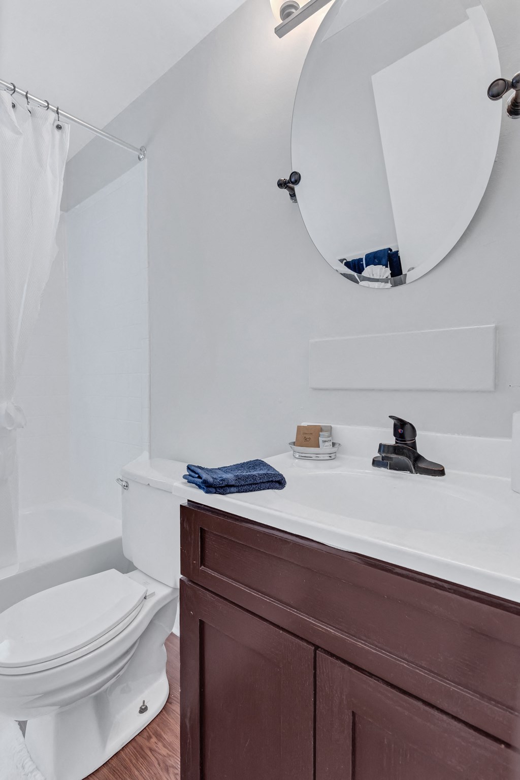 a bathroom with a toilet and a sink and a mirror