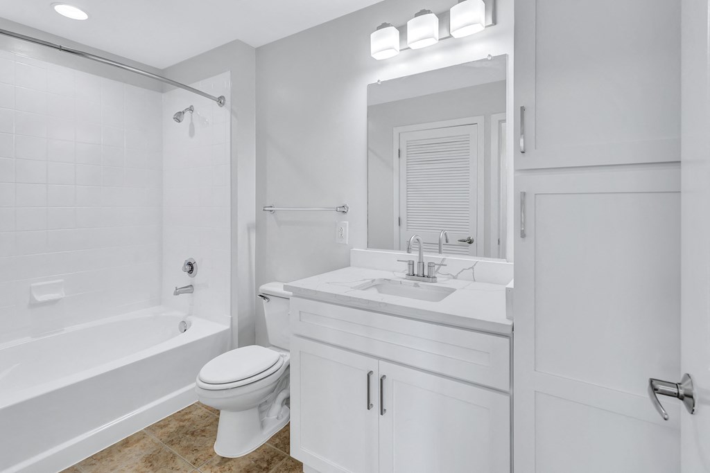 a bathroom with a sink toilet and a shower