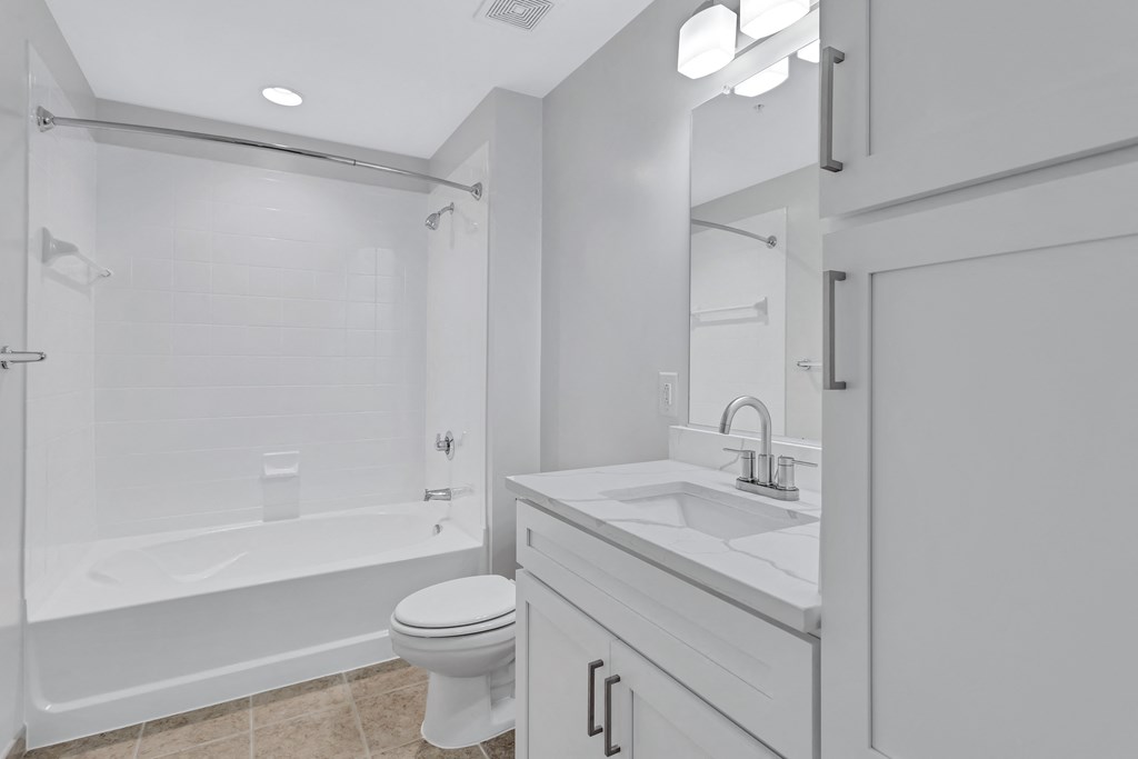 a bathroom with a sink toilet and a shower